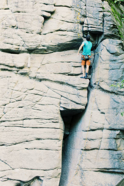 istock Climber to climb a big wall.Climber to climb a big wall. 914625356