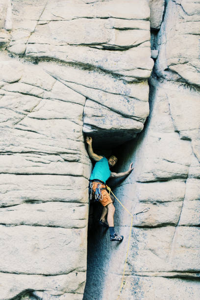 istock Climber to climb a big wall.Climber to climb a big wall. 914625382