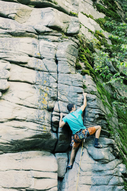 istock Climber to climb a big wall.Climber to climb a big wall. 914625452