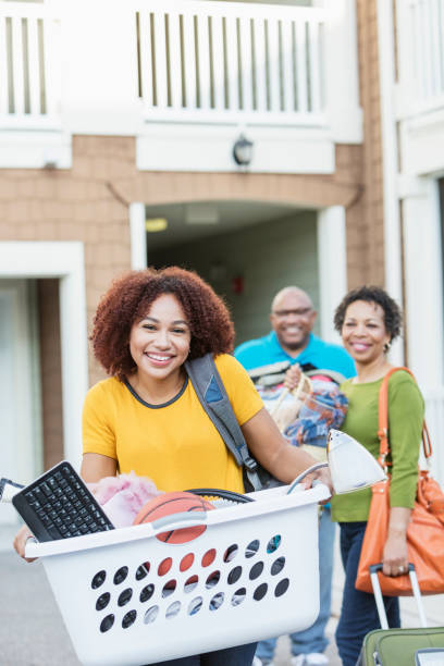 istock African-American parents helping daughter move 914625530