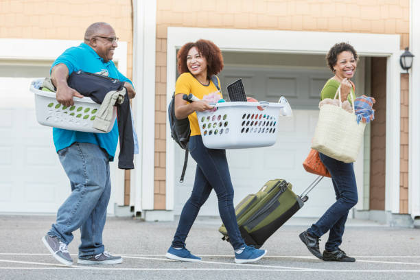 istock African-American parents helping daughter move 914625540