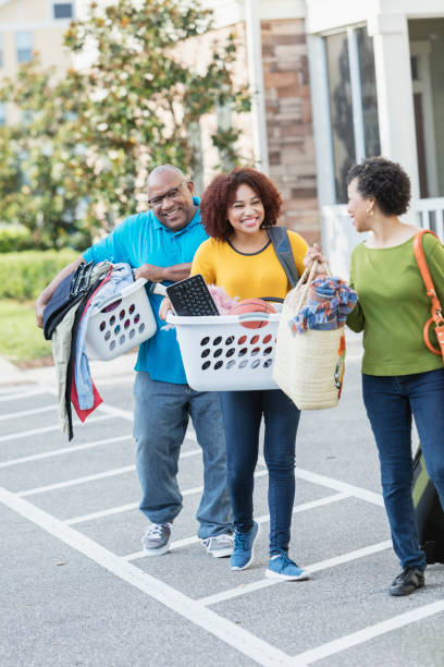 istock African-American parents helping daughter move 914625612