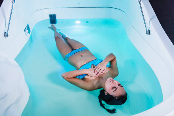 istock Young woman in sensory deprivation tank 914630708
