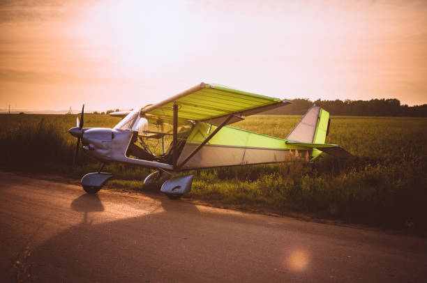 istock Small plane in the sky and on the field 914630952