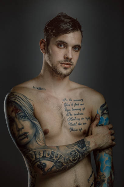 istock Young shirtless man with tattoos 914633922