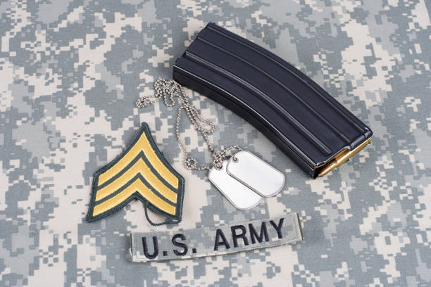 istock M-16 magazine with ammo on camouflage US Army uniform 914636884