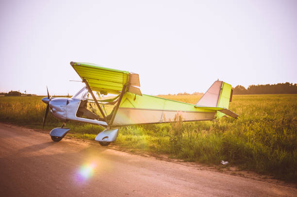 istock Small plane in the sky and on the field 914636928