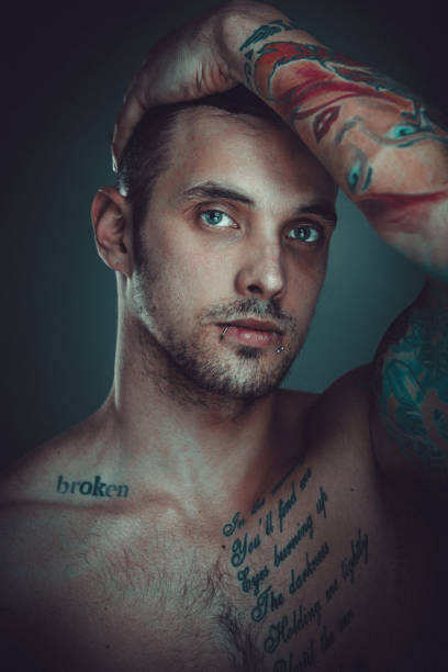 istock Young shirtless man with tattoos 914640444
