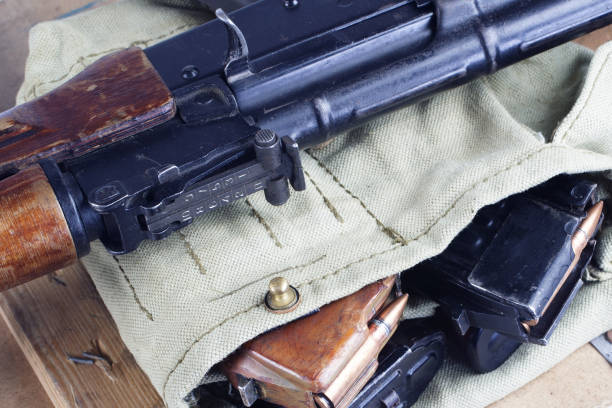 istock AK47 on USSR Soviet Army khaki uniform background 914640460