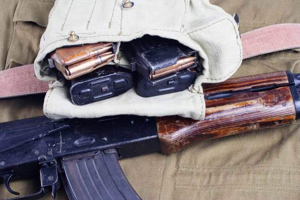 istock AK47 on USSR Soviet Army khaki uniform background 914640494