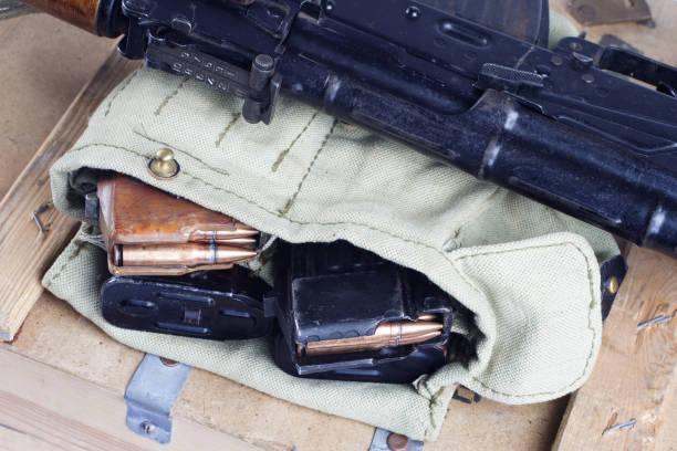 istock AK47 on USSR Soviet Army khaki uniform background 914640520