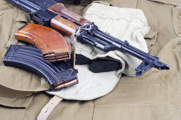istock AK47 on USSR Soviet Army khaki uniform background 914640562