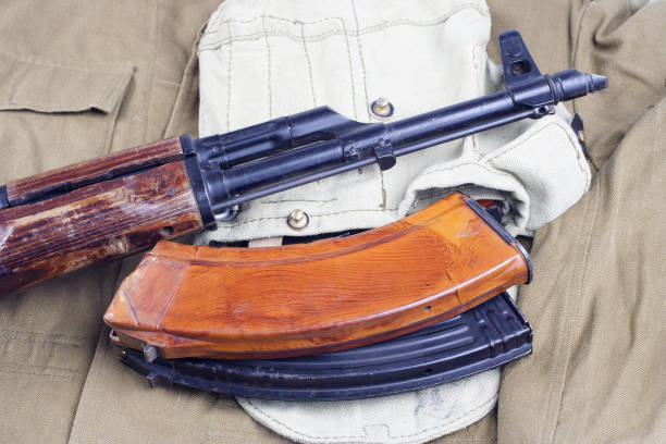 istock AK47 on USSR Soviet Army khaki uniform background 914640634