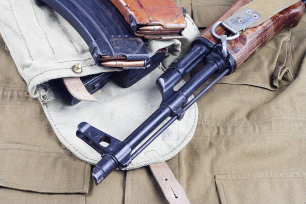 istock AK47 on USSR Soviet Army khaki uniform background 914640730