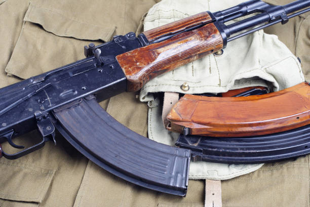 istock AK47 on USSR Soviet Army khaki uniform background 914640870