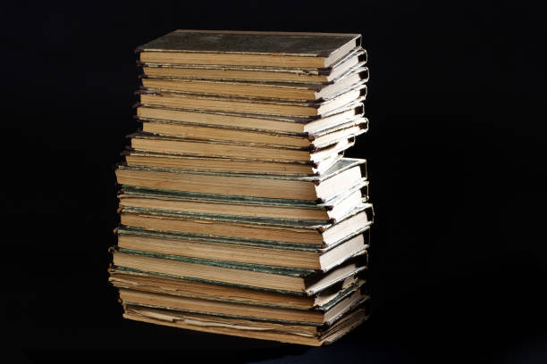 istock Old vintage books on a black background 914641318