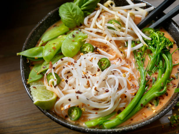 istock Red Curry Noodle Soup with Broccolini, Bean Sprouts and Fresh Basil, 914644482