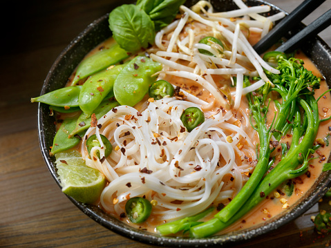 Thai Red Curry Noodle Soup with Broccoli, Bean Sprouts, Fresh Basil, Lime and Chili Flakes