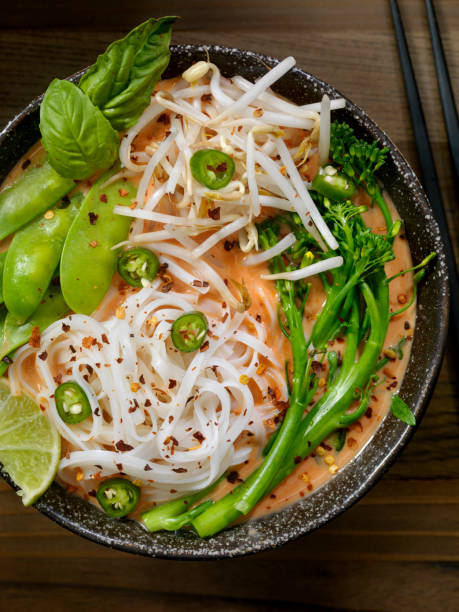 istock Red Curry Noodle Soup with Broccolini, Bean Sprouts and Fresh Basil, 914644530