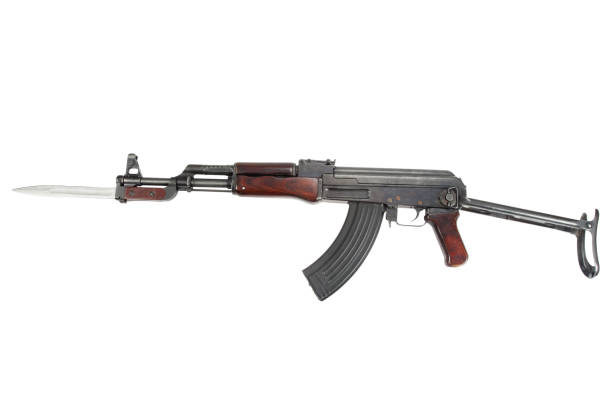 istock Rare first model AK - 47 assault rifle with bayonet isolated on white 914645108
