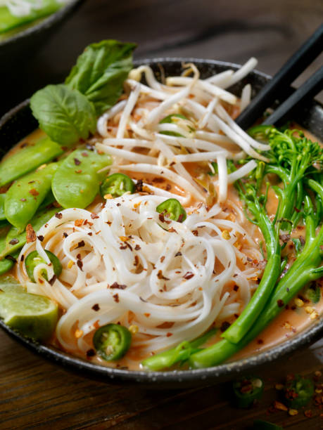 istock Red Curry Noodle Soup with Broccolini, Bean Sprouts and Fresh Basil, 914647920
