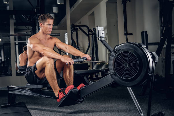istock A man doing workouts on muscles of a back on power weight machin 914648130
