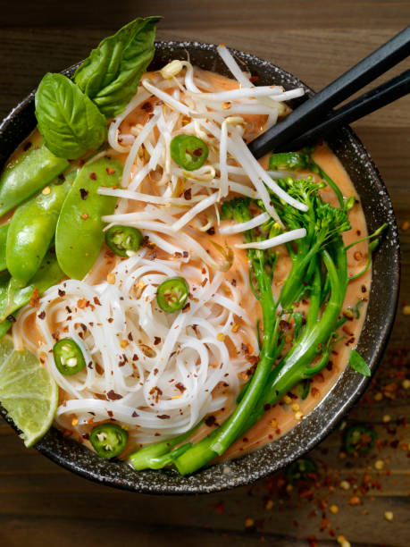 istock Red Curry Noodle Soup with Broccolini, Bean Sprouts and Fresh Basil, 914648168
