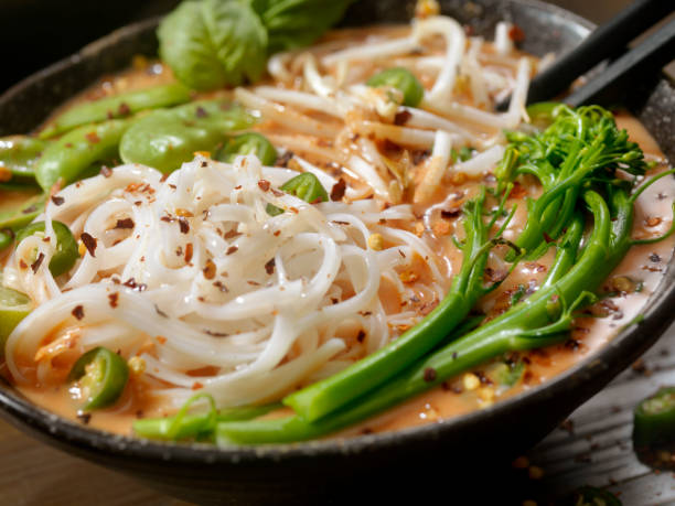 istock Red Curry Noodle Soup with Broccolini, Bean Sprouts and Fresh Basil, 914648212