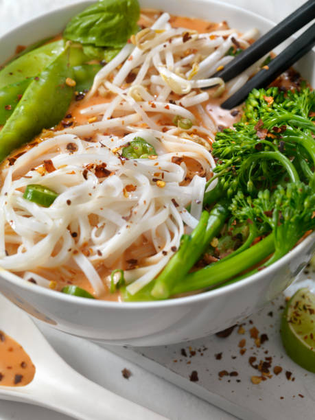 istock Red Curry Noodle Soup with Broccolini, Bean Sprouts and Fresh Basil, 914650622