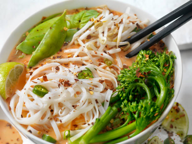 istock Red Curry Noodle Soup with Broccolini, Bean Sprouts and Fresh Basil, 914650632