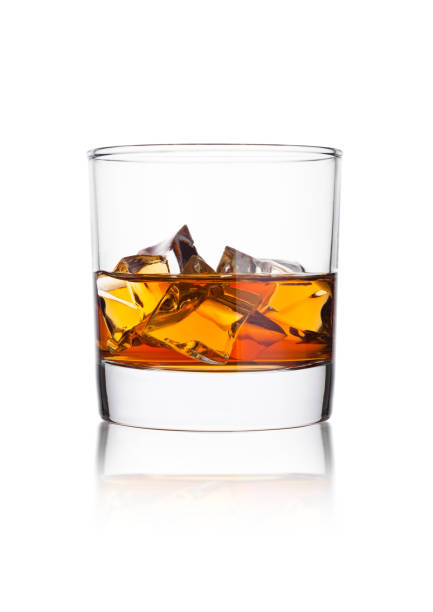 istock Elegant glass of whiskey with ice cubes 914651714