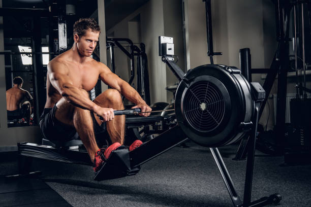istock A man doing workouts on muscles of a back on power weight machin 914651986