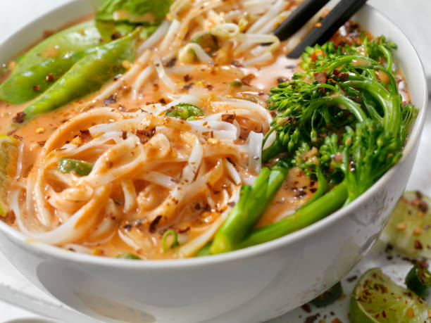 istock Red Curry Noodle Soup with Broccolini, Bean Sprouts and Fresh Basil, 914653070