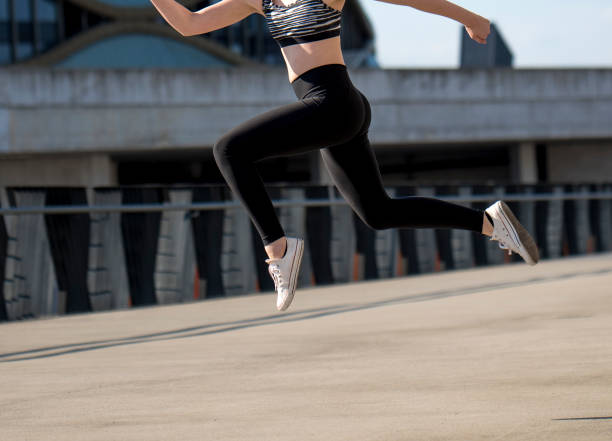 istock Girl jumping outdoors 914658984