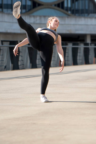 istock Female dancer posing outdoors 914659168