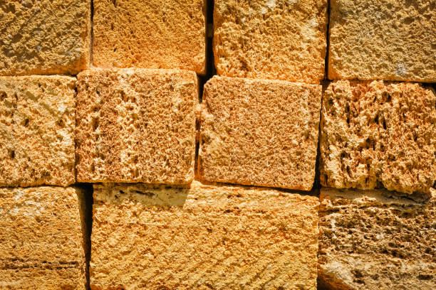 Blocks of shell rock are stacked. Material for building construction. Wall Textured Background.