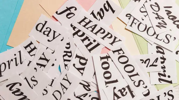 Photo of words Happy April Fools Day on colorful background