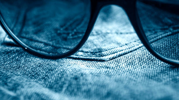 джинсовая одежда, лежащая на столе в очках - traditional culture pattern rural scene surface level стоковые фото и изображения