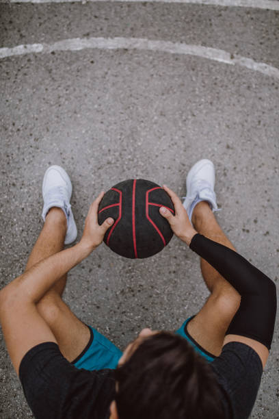 istock Young man sitting on outdoor court 914676356