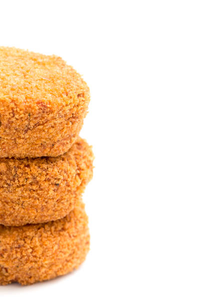 istock Lushious Battered Crab Cakes Isolated on a White Background 914676546