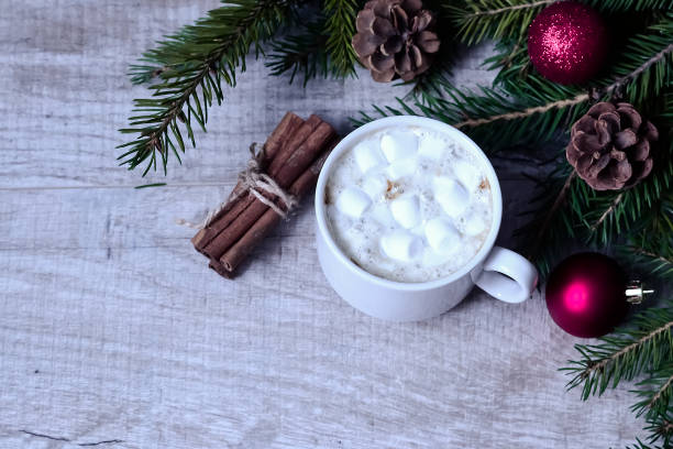 istock Coffee with marshmallows at the Christmas tree. Festive warming 914676794