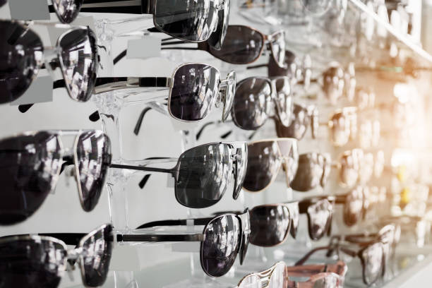 istock Sunglasses on shelves in glasses store 914679322
