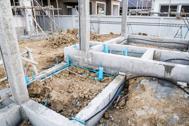 istock Pest control pipe system install at new house construction foundation for termite protection 914679344
