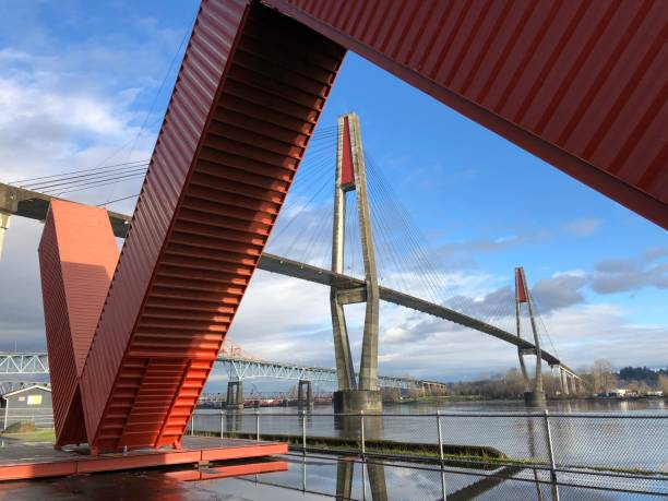 Great views of the city of New Westminster and Fraser River, Pattullo bridge and Sky-Train bridge New Westminster, BC, Canada - February 4, 2018 : Great views of the city of New Westminster and Fraser River, Pattullo bridge and Sky-Train bridge with the WOW Westminster made by Four corten steel shipping containers new westminster stock pictures, royalty-free photos & images