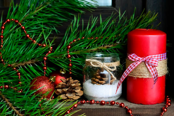istock Candle on the table near the Christmas tree. Christmas present 914682968