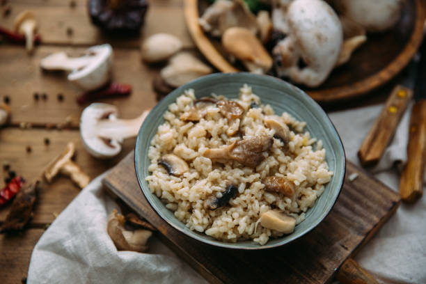 istock Bowl of Mushroom Risotto garnished with Thyme leaves, selective focus 914684270