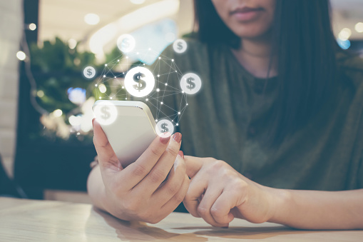 Asian woman hand using mobile phone with online transaction application, Concept e-commerce and internet online investment