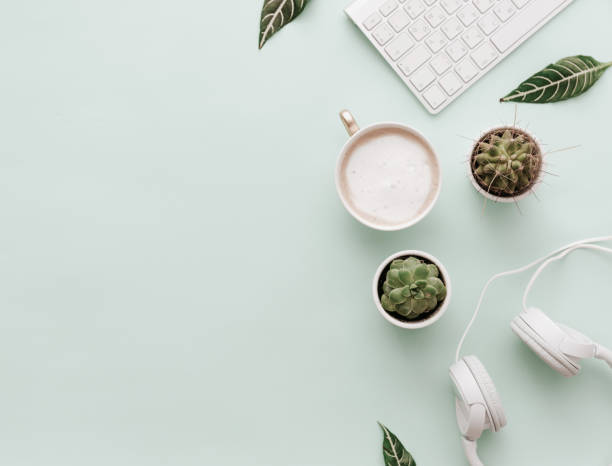 istock Minimalist Flat Lay Hipster Desktop With Coffee and Headphones 914686988