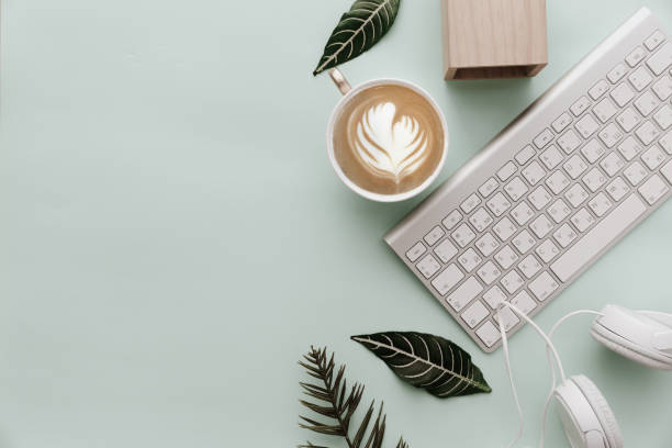 Minimalist Flat Lay Hipster Desktop With Coffee and Keyboard