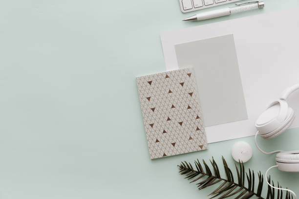 istock Minimalist Flat Lay Hipster Desktop. Blogger Pastel Background With notebook, headphones. Flat lay 914687092